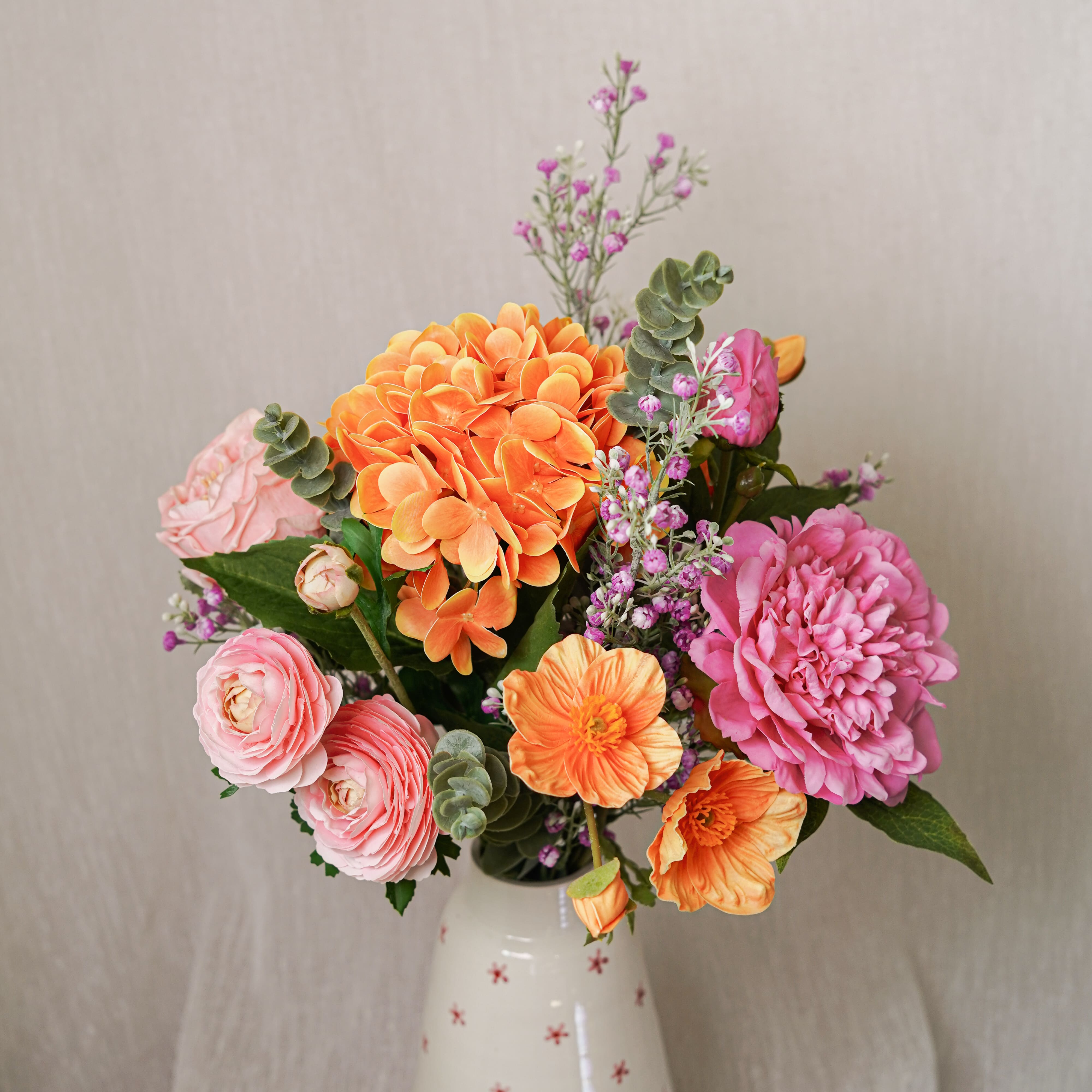 Flowrette Adèle bouquet fleurs artificielles orange rose sans entretien