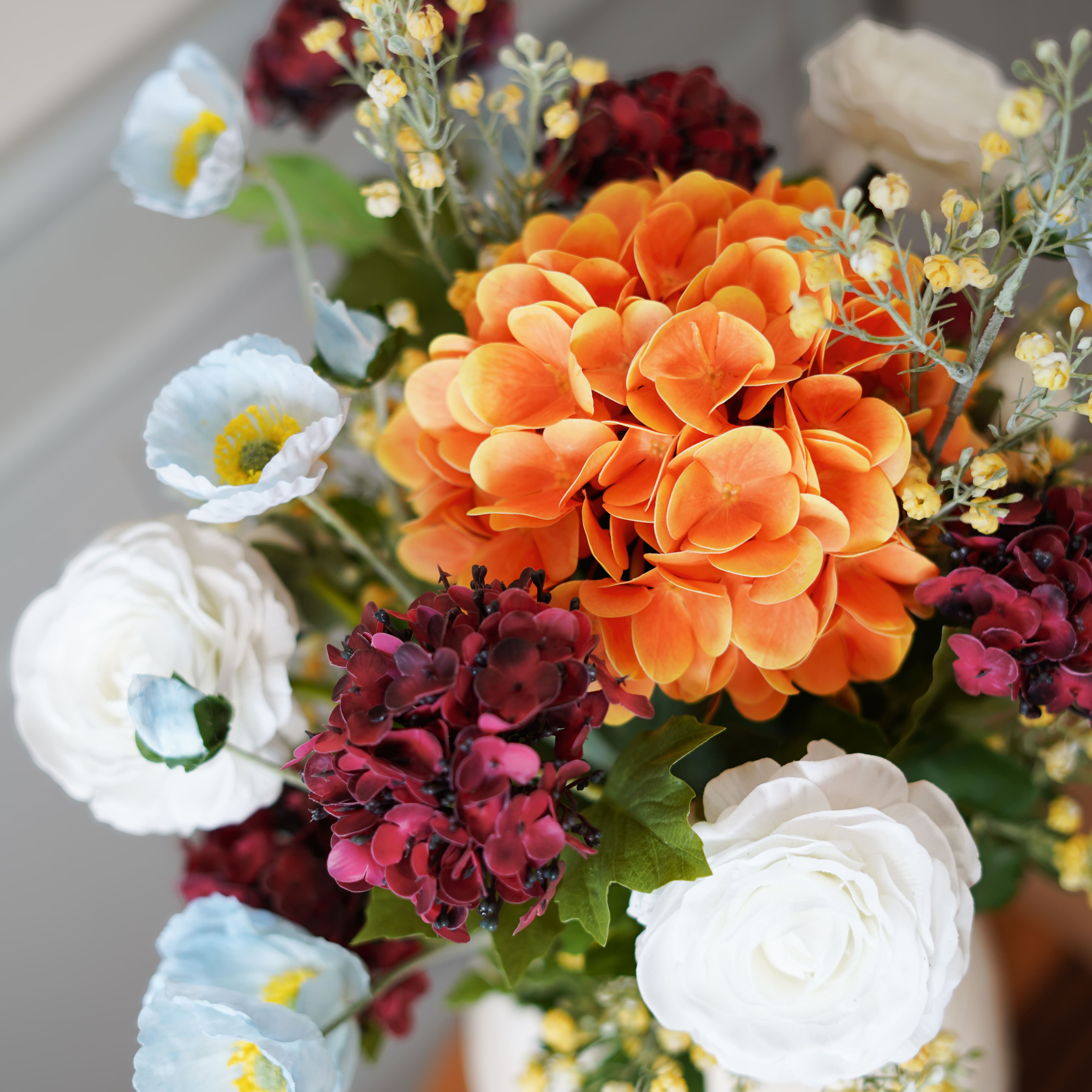 Flowrette Alma bouquet fleurs artificielles orange bordeaux
