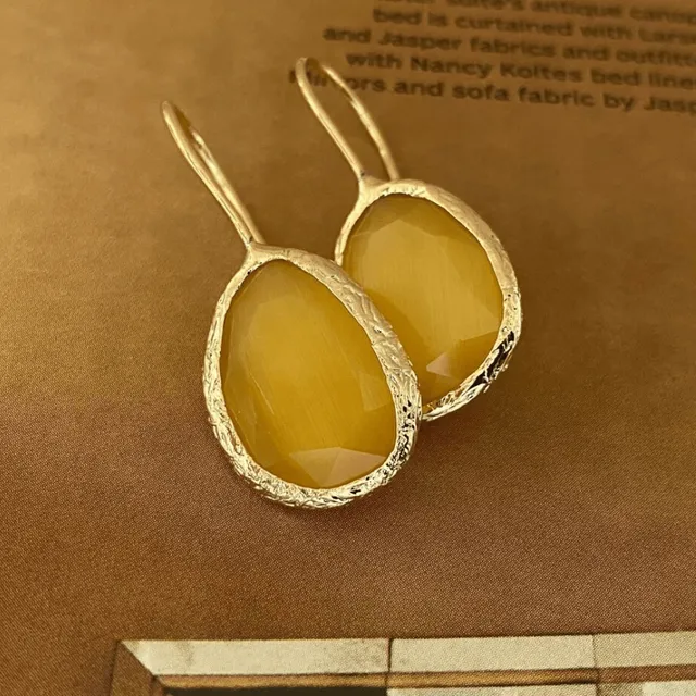 Flowrette Lueur boucle d'oreille jaune laiton doré