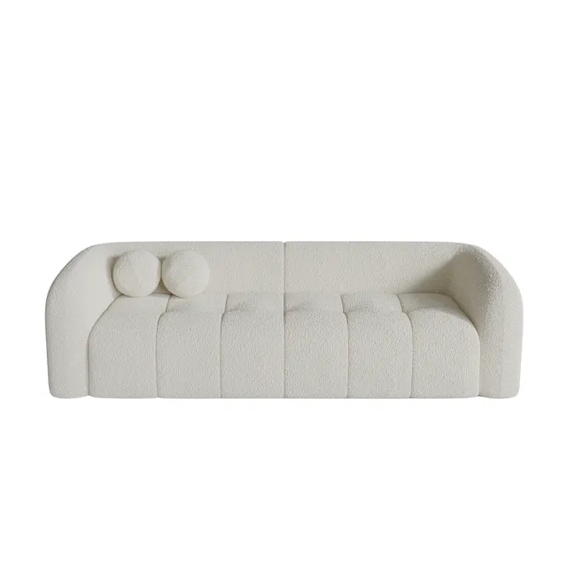 Sia Haussmann canapé crème courbes arrondies coussins boules