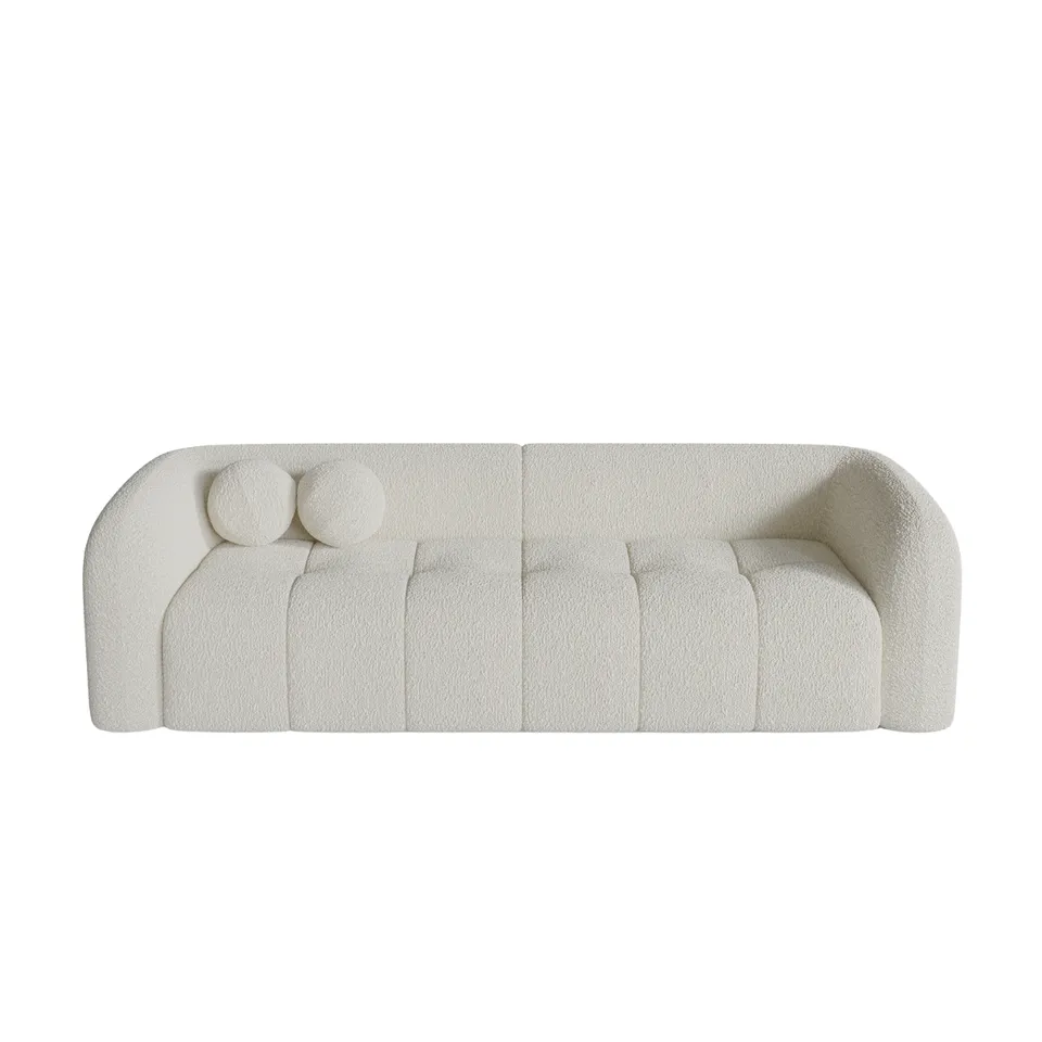 Sia Haussmann canapé crème courbes arrondies coussins boules